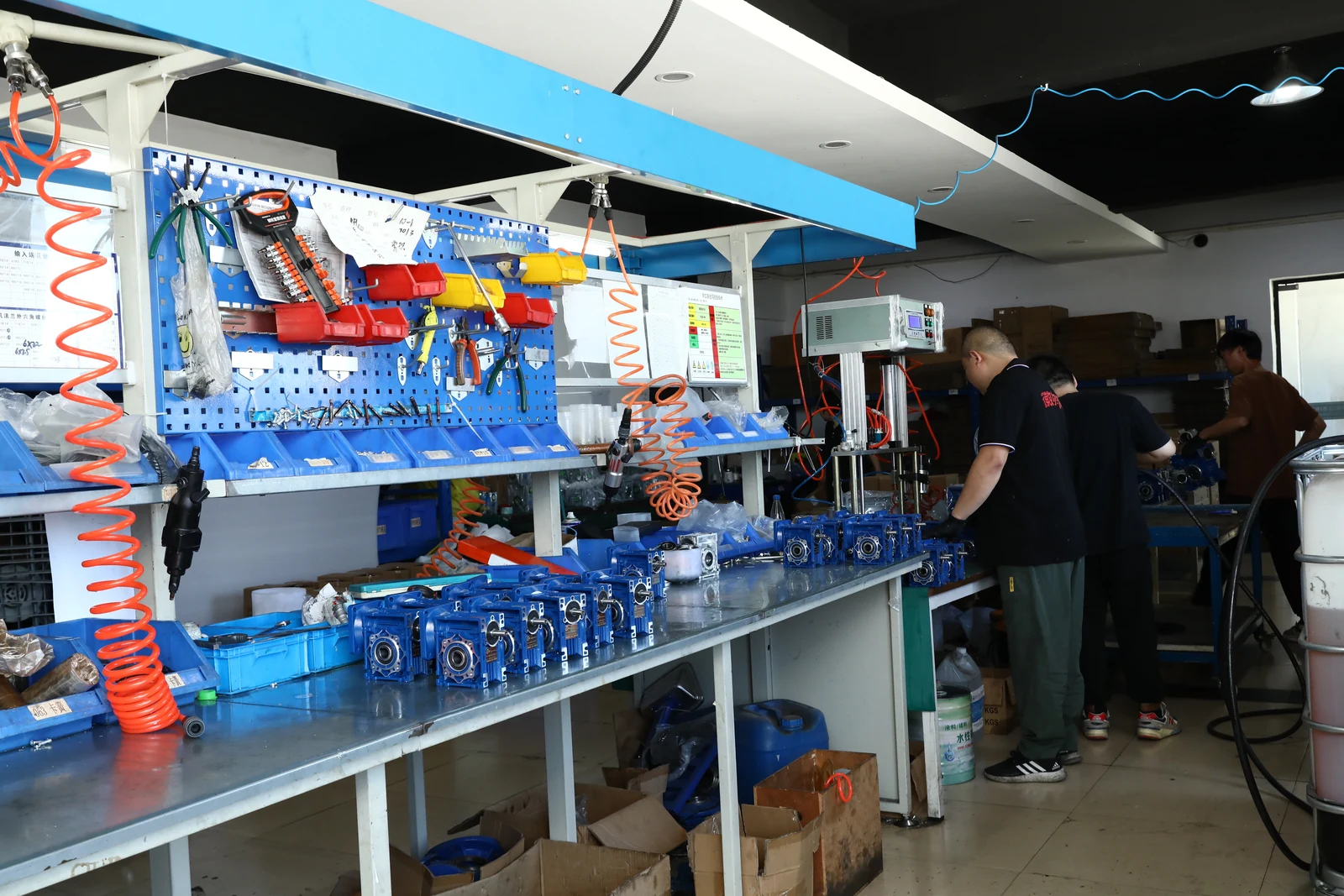 SMK workers assembling NMRV worm gearboxes